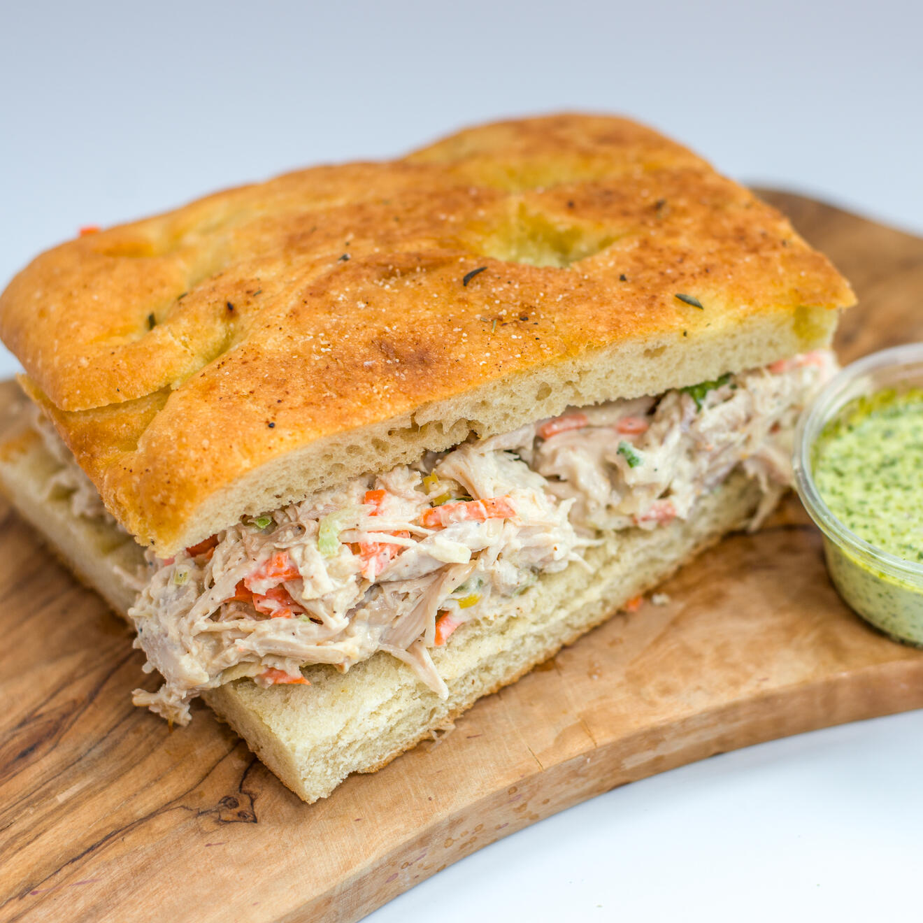 House-Made Bread. Generous Filling. Big Flavor. Our focaccia sandwiches are made with soft, golden focaccia and filled with flavorful meats, sauces, and fresh ingredients. Moist, hearty, and satisfying — not a dry sandwich.